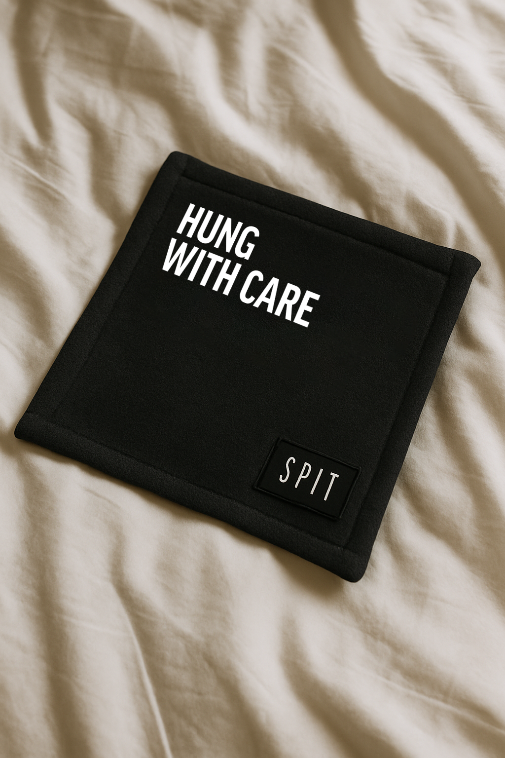 SPIT RAW – “Hung with Care” Towel